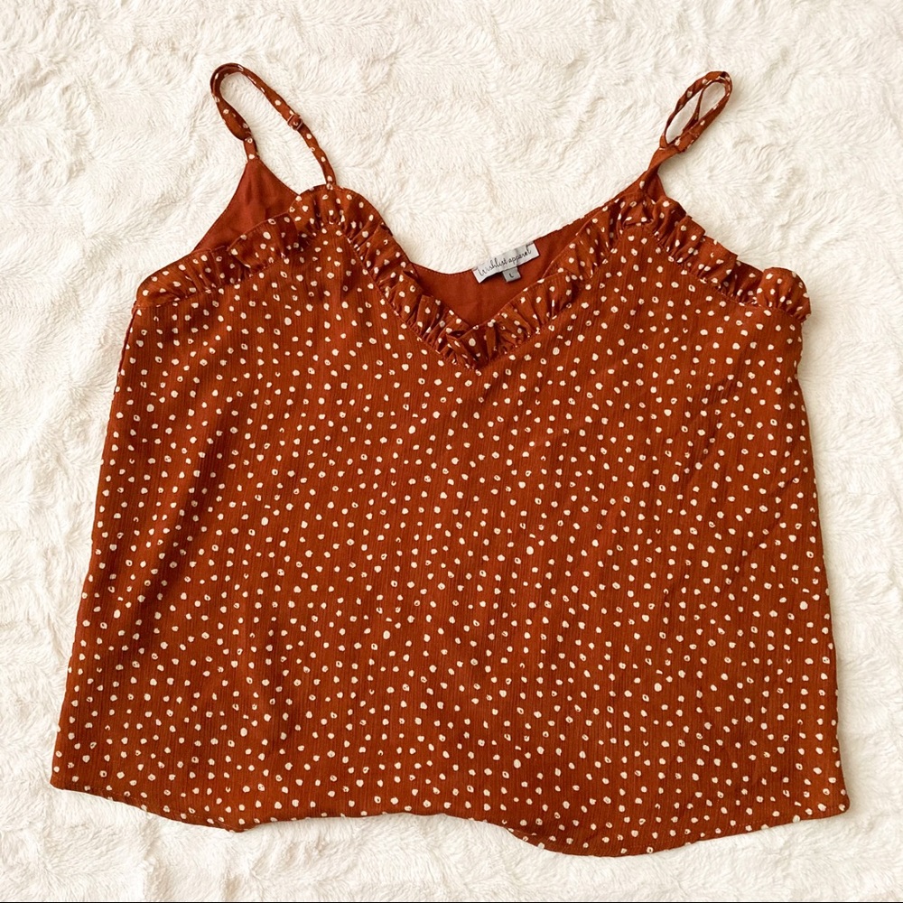 Polka dot cami with ruffled neckline